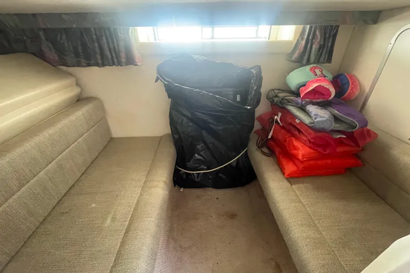 Slide: The Image of Interior cabin of 2001 Monterey 270 Cruiser with seating and storage items. - 15