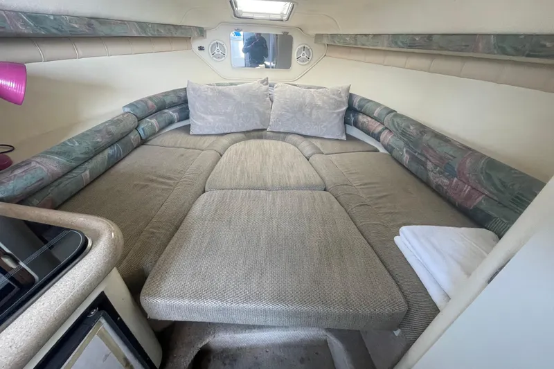 Slide: The Image of Interior cabin of 2001 Monterey 270 Cruiser with cozy seating and cushions. - 16