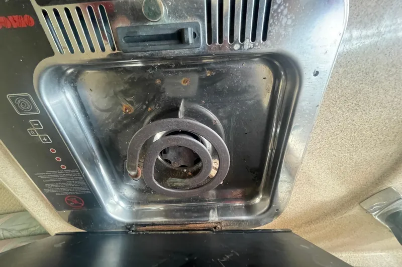 Slide: The Image of Stove burner on 2001 Monterey 270 Cruiser boat, showing wear and usage. - 20