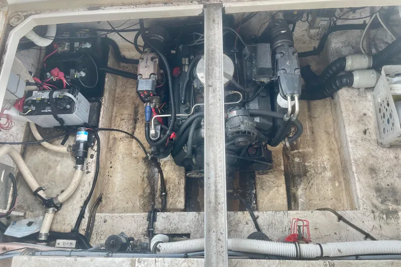 Slide: The Image of Engine compartment of a 2001 Monterey 270 Cruiser boat, showing mechanical components and wiring. - 21