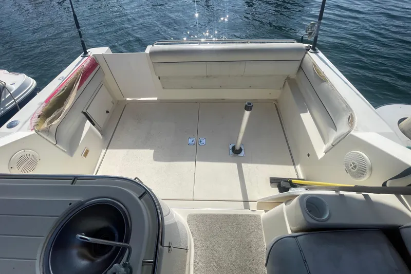 Slide: The Image of 2001 Monterey 270 Cruiser boat interior with seating and water view. - 7