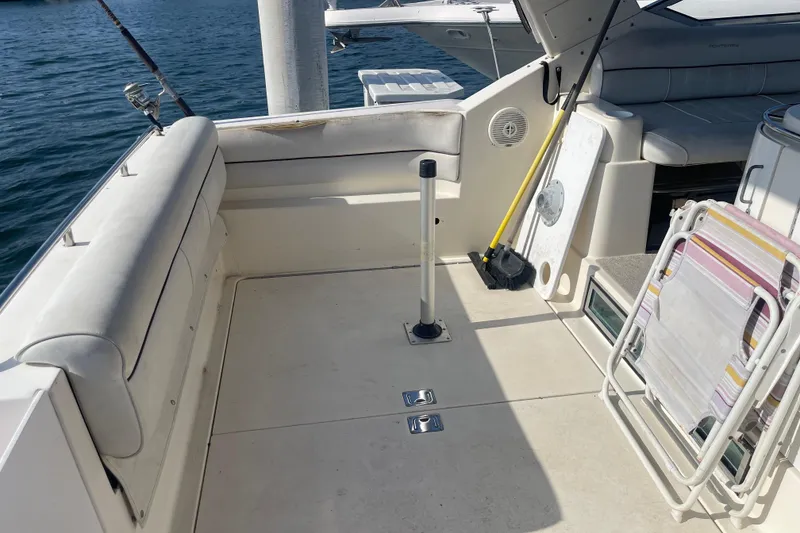 Slide: The Image of 2001 Monterey 270 Cruiser boat interior with seating and fishing rod holder. - 8