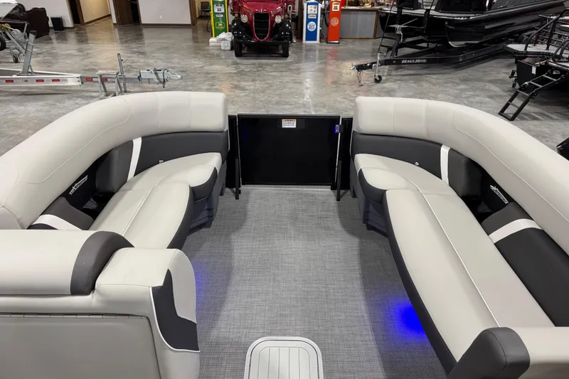 Slide: The Image of Interior of 2025 Sylvan X-5 boat with modern seating and ambient lighting. - 10