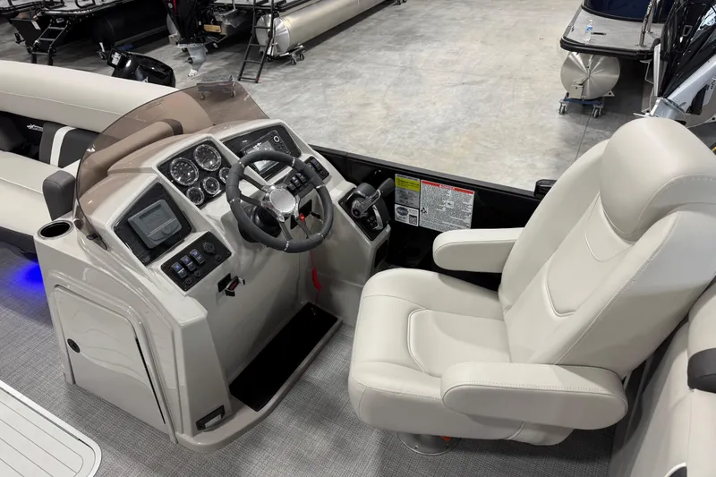 Slide: The Image of 2025 Sylvan X-5 boat interior with modern dashboard and comfortable captain's chair. - 11