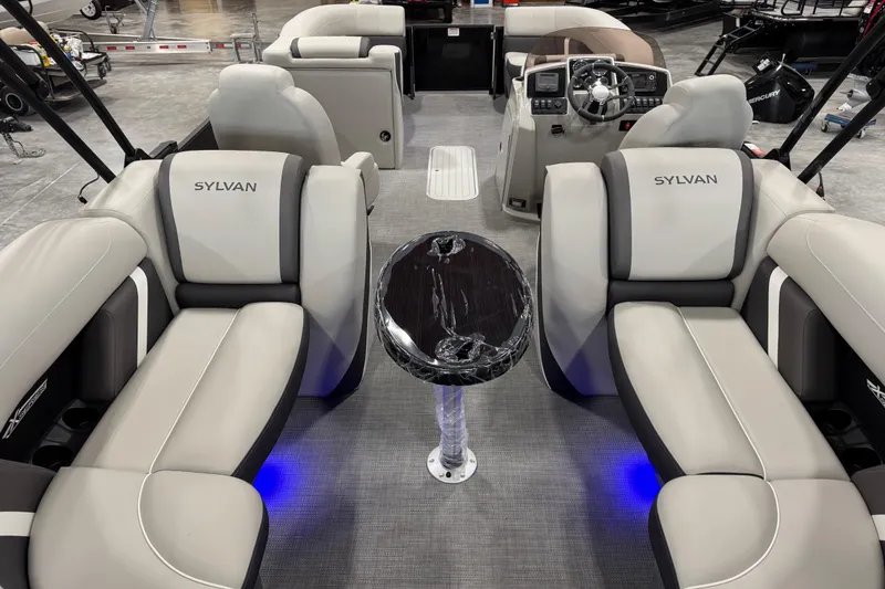 Slide: The Image of 2025 Sylvan X-5 boat interior with luxurious seating and modern dashboard. - 7