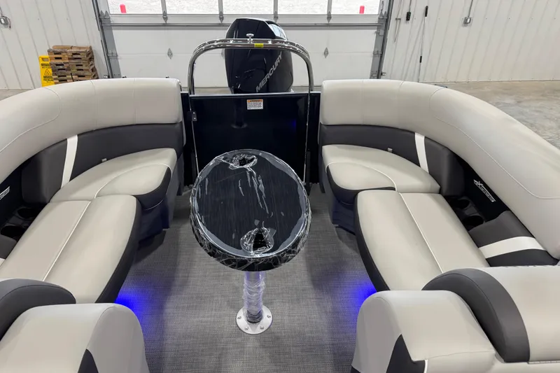 Slide: The Image of Luxurious interior of 2025 Sylvan X-5 boat with plush seating and modern table. - 8
