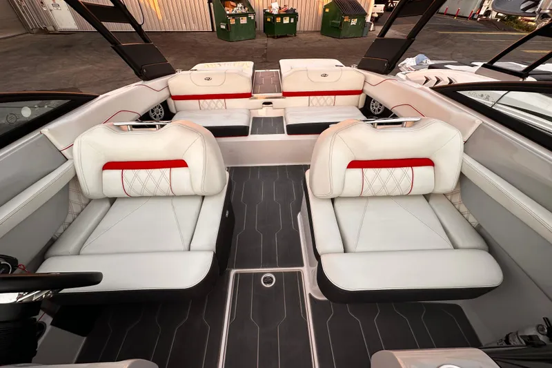 Slide: The Image of 2020 Regal LS2 Surf boat interior with white and red seating, modern design. - 10