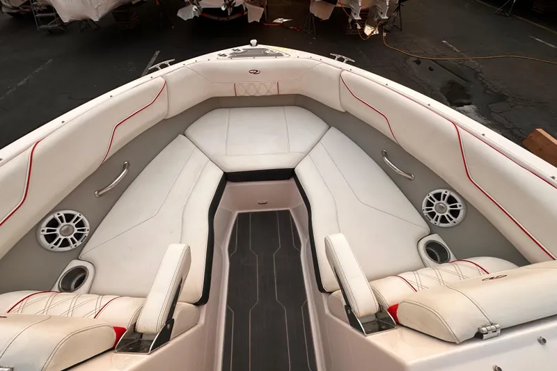 Slide: The Image of 2020 Regal LS2 Surf boat interior with white seating and red accents. - 13