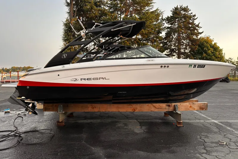 Slide: The Image of 2020 Regal LS2 Surf boat on display, featuring sleek design and modern features. - 2