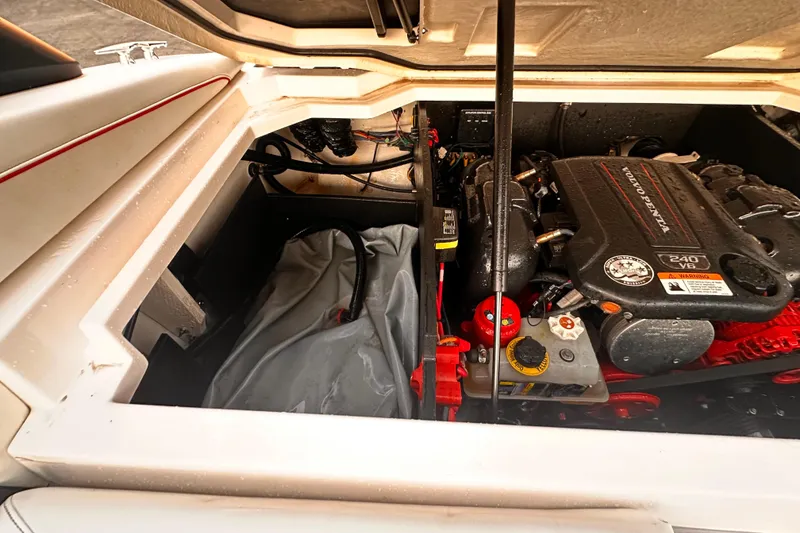Slide: The Image of 2020 Regal LS2 Surf boat engine compartment with Volvo Penta V6 engine. - 26