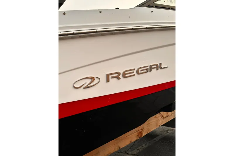 Slide: The Image of 2020 Regal LS2 Surf boat with logo on the side, featuring sleek design. - 30