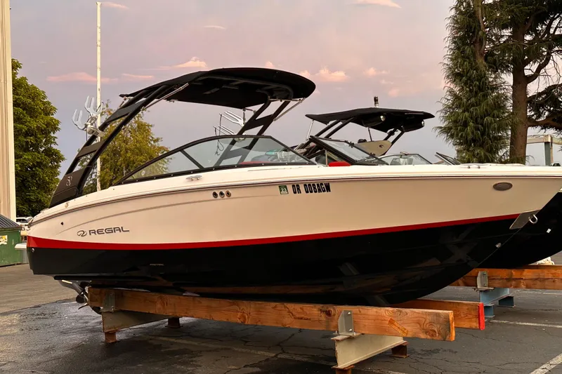 Slide: The Image of 2020 Regal LS2 Surf boat on display, featuring sleek design and modern features. - 32