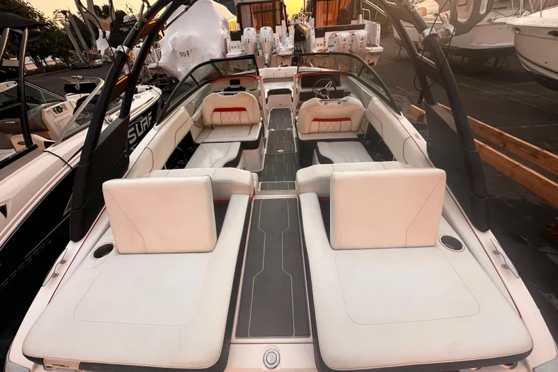 Slide: The Image of 2020 Regal LS2 Surf boat interior with white seating and sleek design. - 4