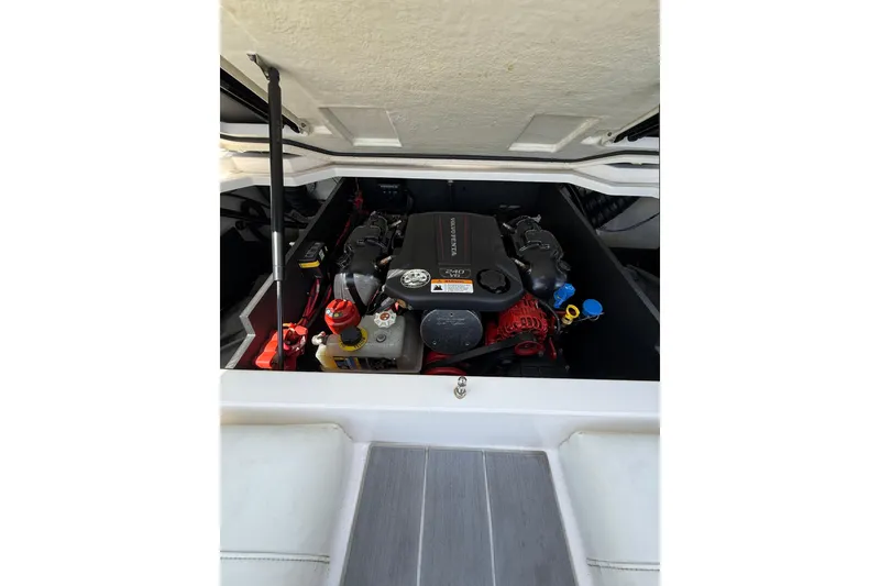 Slide: The Image of Engine compartment of a 2020 Regal LS2 Surf boat, showcasing the Volvo Penta engine. - 22
