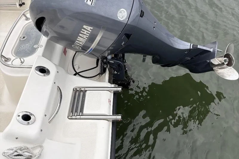 Slide: The Image of 2014 Key West 211 Dual Console boat with Yamaha outboard motor on water. - 11