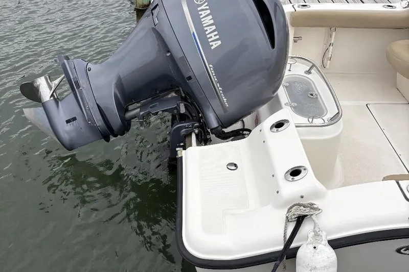 Slide: The Image of 2014 Key West 211 Dual Console boat with Yamaha outboard motor on water. - 13