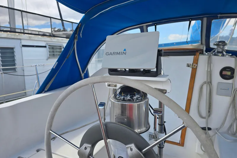 Slide: The Image of Steering wheel and Garmin navigation on 1987 Nonsuch 30 Ultra sailboat cockpit. - 12