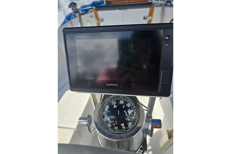 Slide: The Image of Garmin GPS and compass on 1987 Nonsuch 30 Ultra sailboat cockpit. - 13