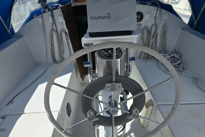 Slide: The Image of Steering wheel and navigation equipment on 1987 Nonsuch 30 Ultra sailboat. - 14