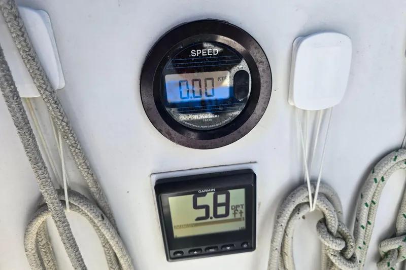 Slide: The Image of Speed and depth gauges on 1987 Nonsuch 30 Ultra sailboat dashboard. - 16