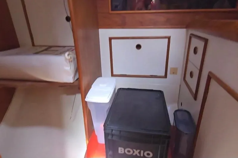 Slide: The Image of Interior of 1987 Nonsuch 30 Ultra sailboat with storage and bunk bed. - 23