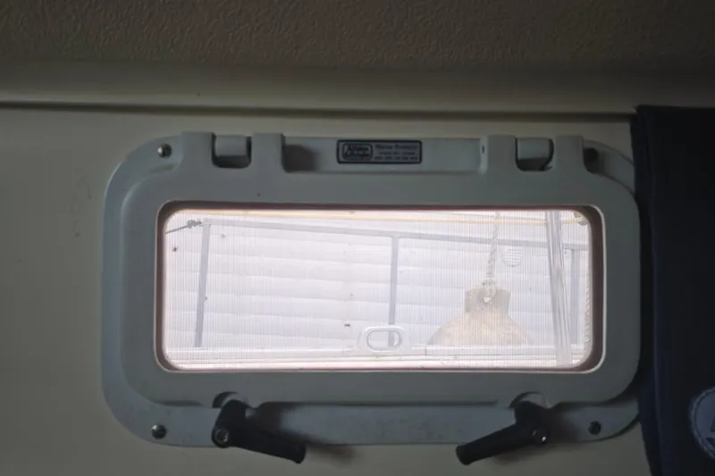 Slide: The Image of Porthole view from 1987 Nonsuch 30 Ultra sailboat interior. - 28