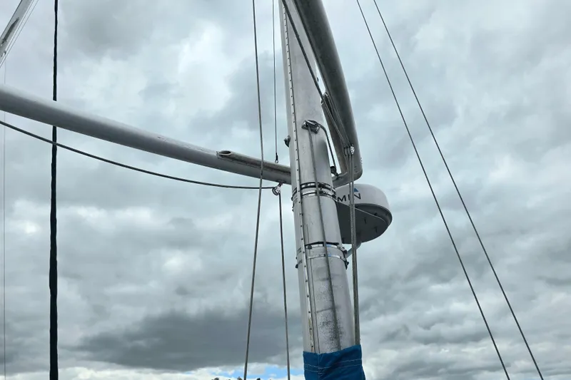 Slide: The Image of Mast of 1987 Nonsuch 30 Ultra sailboat against cloudy sky. - 34