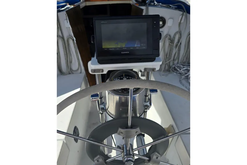 Slide: The Image of Cockpit of 1987 Nonsuch 30 Ultra sailboat with Garmin GPS and steering wheel. - 35