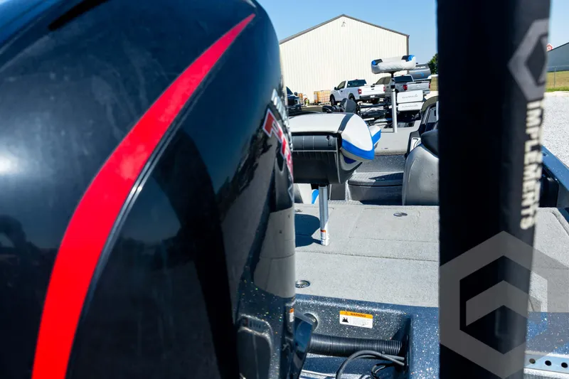 Slide: The Image of 2023 Caymas CX19 boat on trailer, featuring sleek blue and silver design. - 21