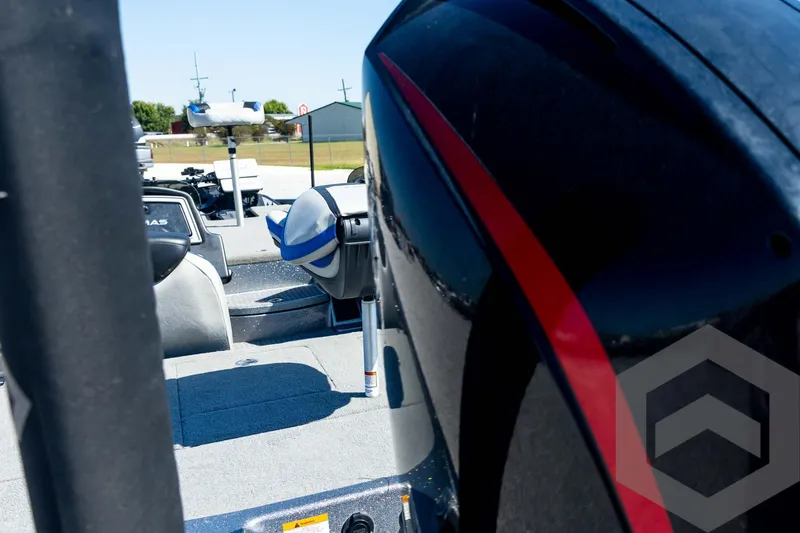 Slide: The Image of Trailer of 2023 Caymas CX19 boat with spare tire on gravel surface. - 22