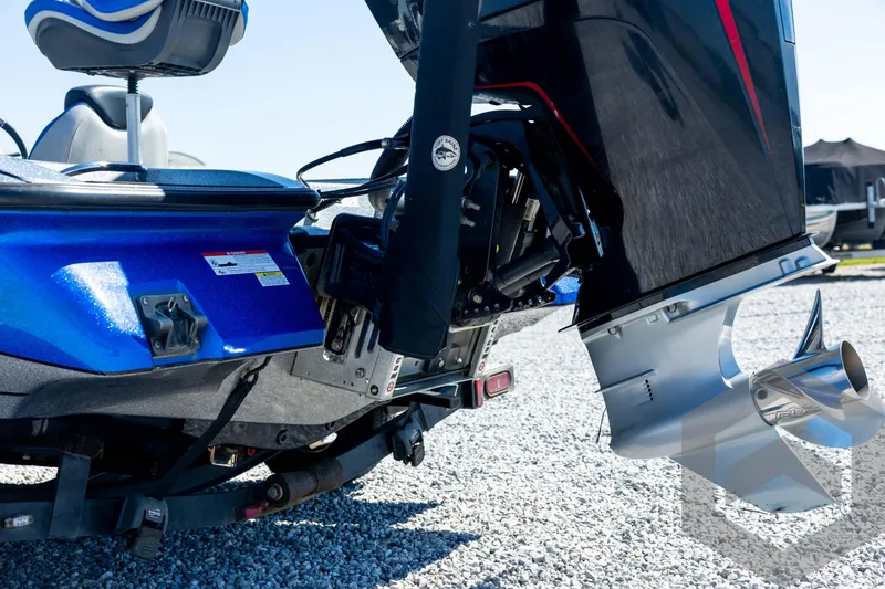 Slide: The Image of 2023 Caymas CX19 boat on trailer, parked on gravel surface. - 24