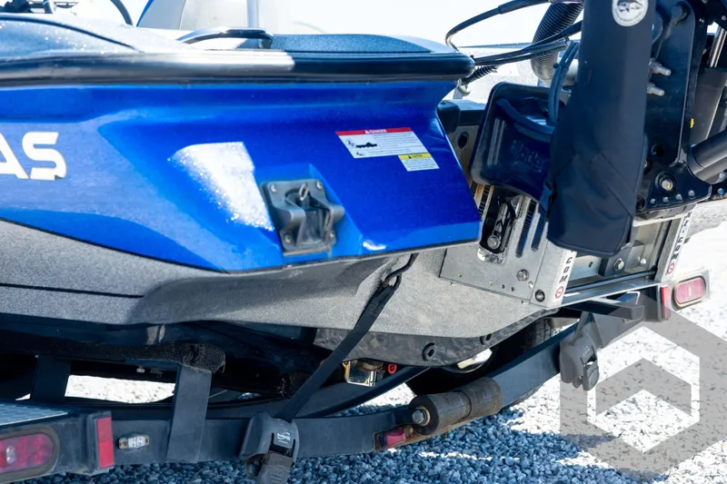 Slide: The Image of 2023 Caymas CX19 boat with sleek design and powerful engine, featuring modern seating. - 25