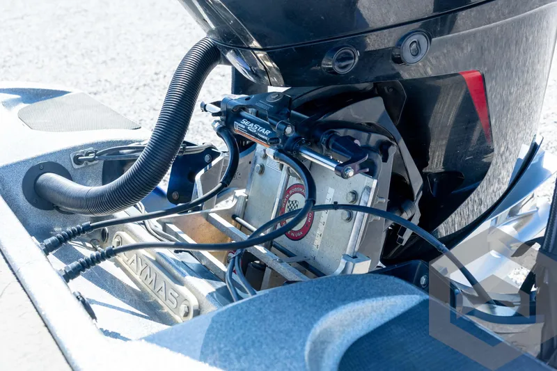 Slide: The Image of 2023 Caymas CX19 boat engine mount with protective cover and blue hull. - 27