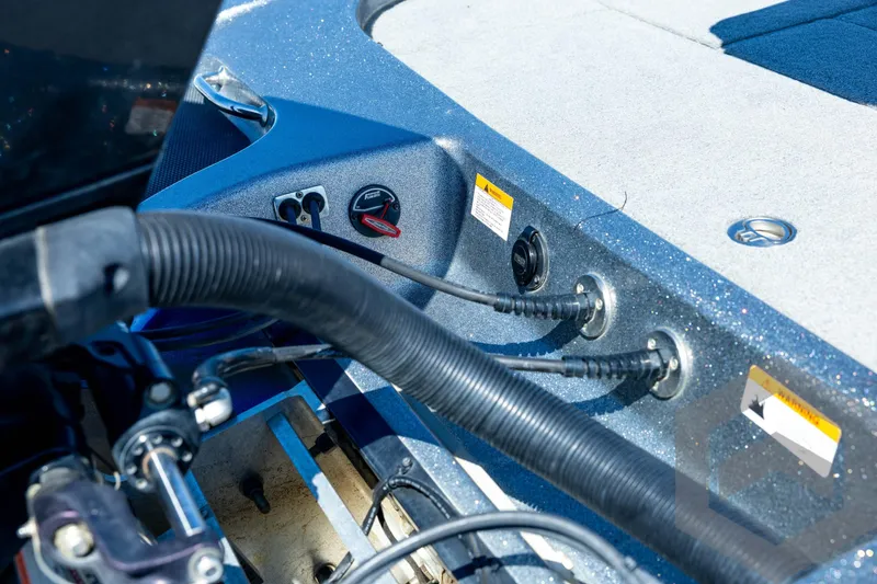 Slide: The Image of 2023 Caymas CX19 boat engine compartment with cables and hydraulic system. - 29