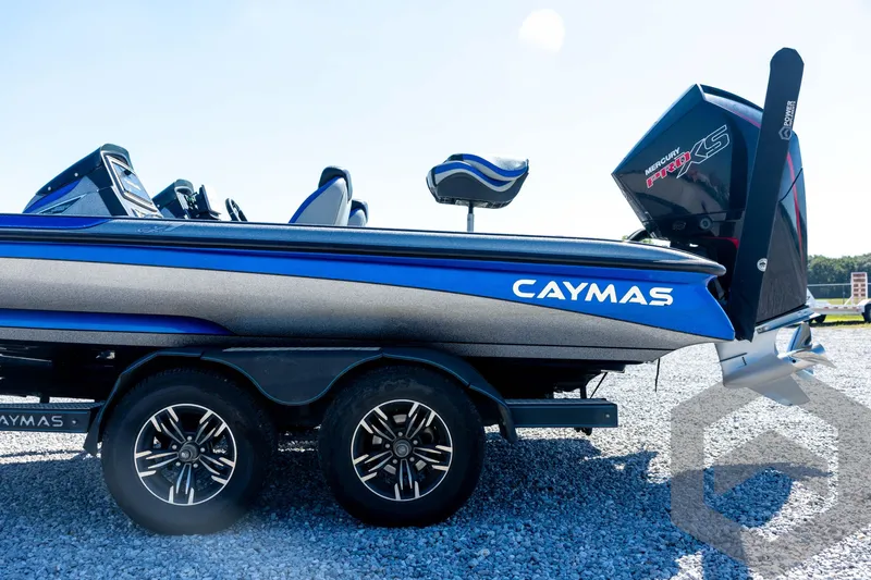 Slide: The Image of 2023 Caymas CX19 boat interior with steering wheel and control panel. - 32