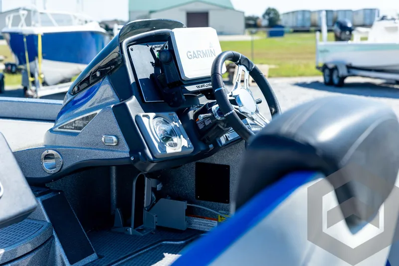 Slide: The Image of 2023 Caymas CX19 boat storage compartments with Garmin electronics, open for viewing. - 34