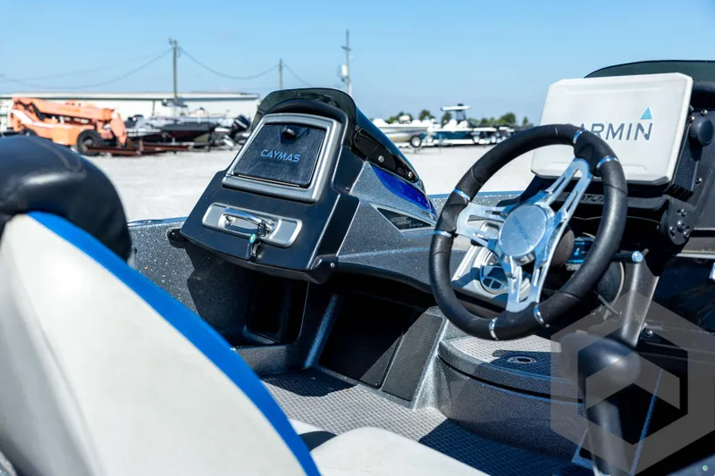 Slide: The Image of 2023 Caymas CX19 boat storage compartments with open hatches and organized interior layout. - 35