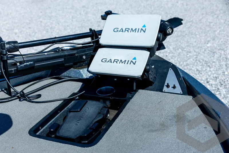 Slide: The Image of 2023 Caymas CX19 boat dashboard with Garmin navigation and steering wheel. - 44