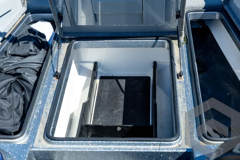 Slide: The Image of 2023 Caymas CX19 boat dashboard with Garmin navigation system and steering wheel. - 47