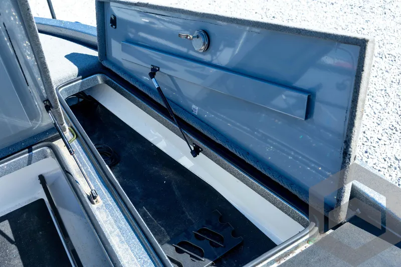 Slide: The Image of 2023 Caymas CX19 boat dashboard with control panel and foot pedal. - 48