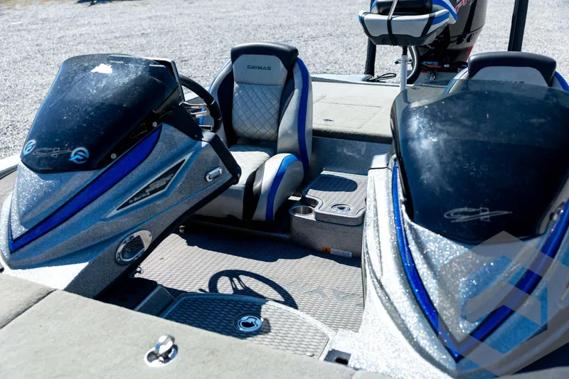 Slide: The Image of 2023 Caymas CX19 boat control panel with switches and key ignition. - 49