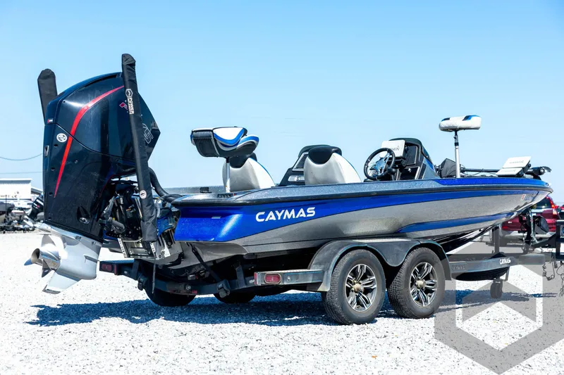 Slide: The Image of 2023 Caymas CX19 boat on trailer, featuring sleek blue and gray design. - 5