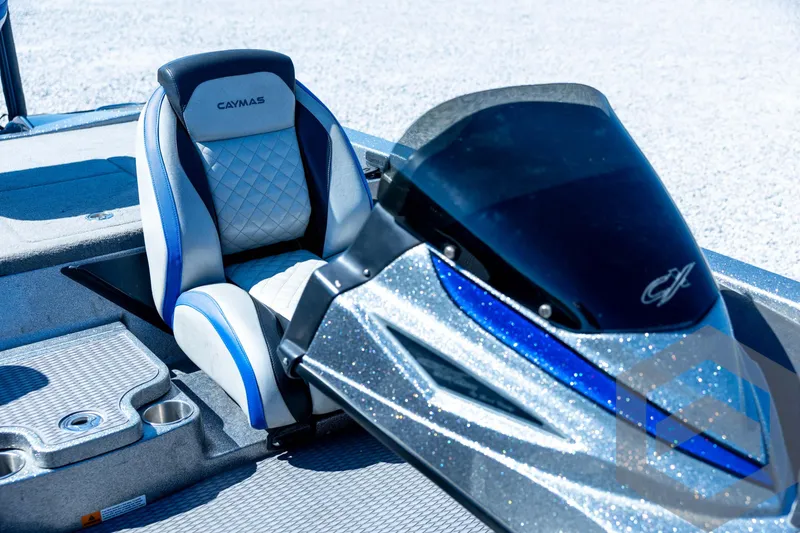 Slide: The Image of 2023 Caymas CX19 boat with Garmin navigation system and steering wheel. - 51