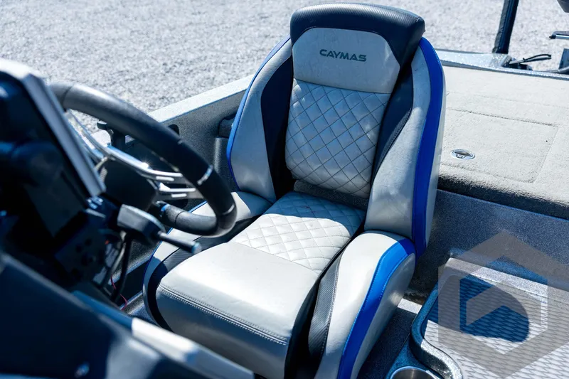 Slide: The Image of 2023 Caymas CX19 boat storage compartment with open lid, showcasing interior space. - 56