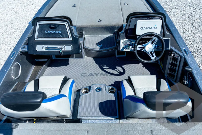 Slide: The Image of 2023 Caymas CX19 boat storage compartments with open lids, showcasing interior design. - 57