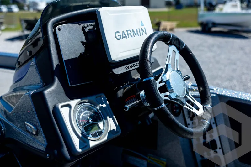 Slide: The Image of 2023 Caymas CX19 boat, aerial view, showcasing seating and deck layout on gravel background. - 58