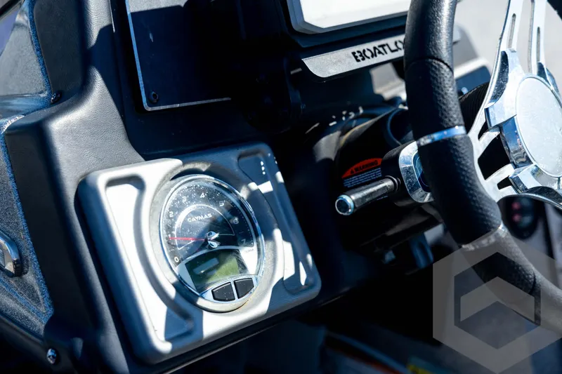 Slide: The Image of 2023 Caymas CX19 boat interior with dual seats and Garmin navigation system. - 60