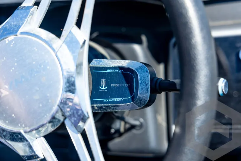 Slide: The Image of 2023 Caymas CX19 boat interior with three seats and carpeted flooring. - 61