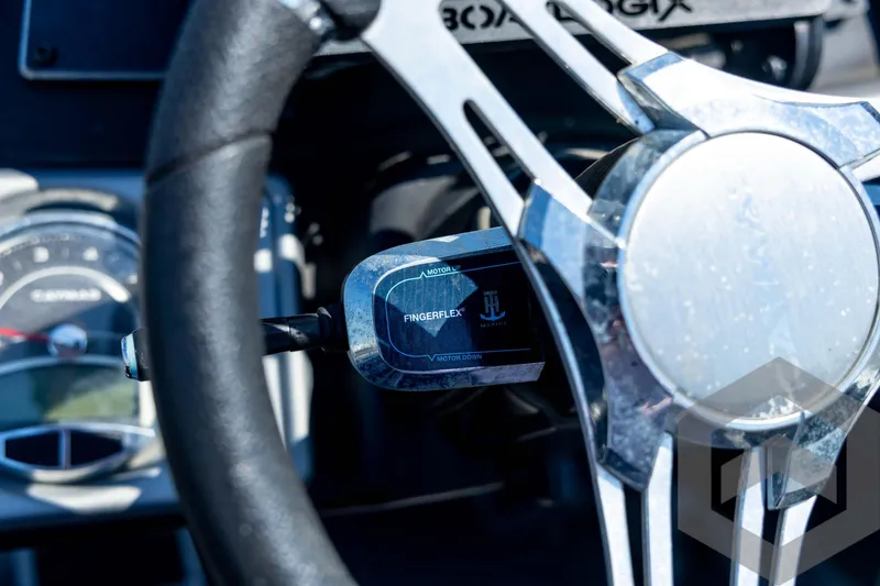 Slide: The Image of Top view of 2023 Caymas CX19 boat interior with seating and motor. - 62