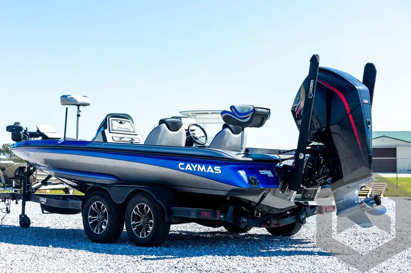 Slide: The Image of 2023 Caymas CX19 boat with Mercury Pro XS engine, parked near a truck. - 7
